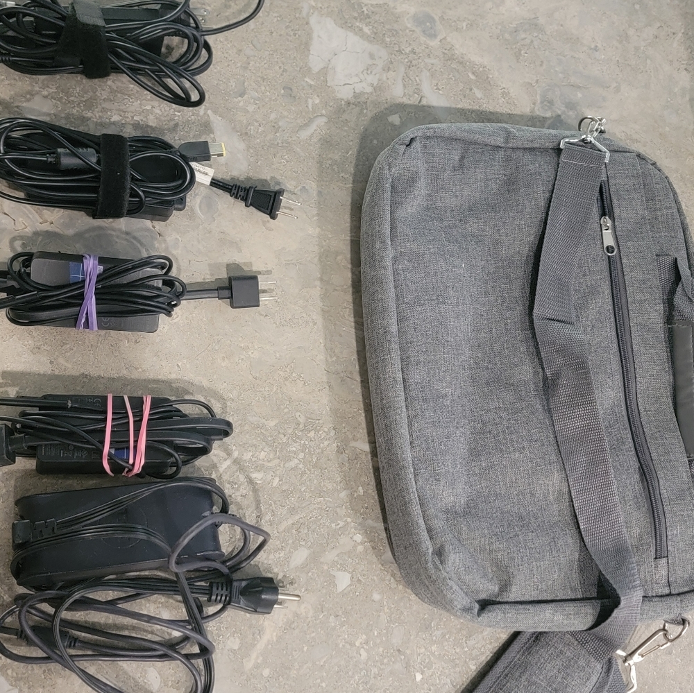5 computer chargers and a computer bag